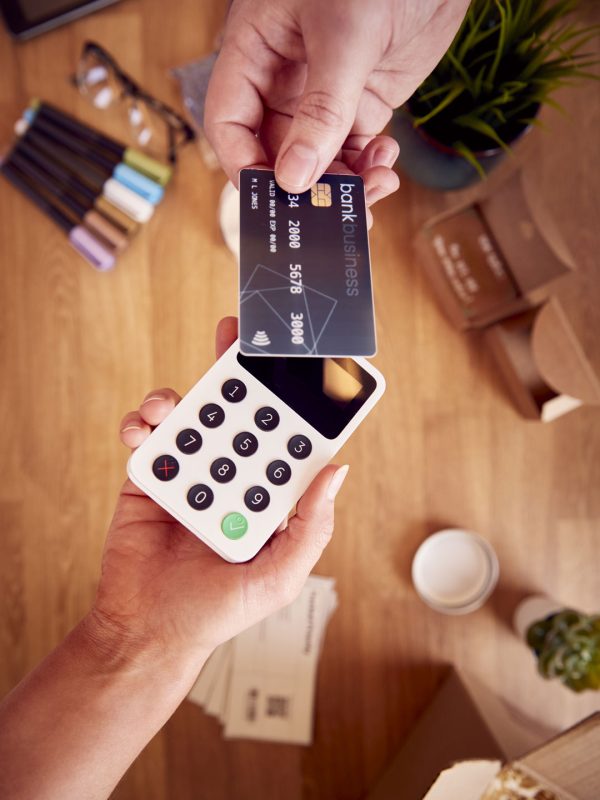 overhead-shot-of-contactless-card-payment-being-ta-2022-06-23-20-13-59-utc